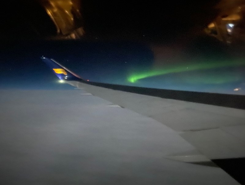 The Northern Lights while flying to the UK with a stopover in Iceland